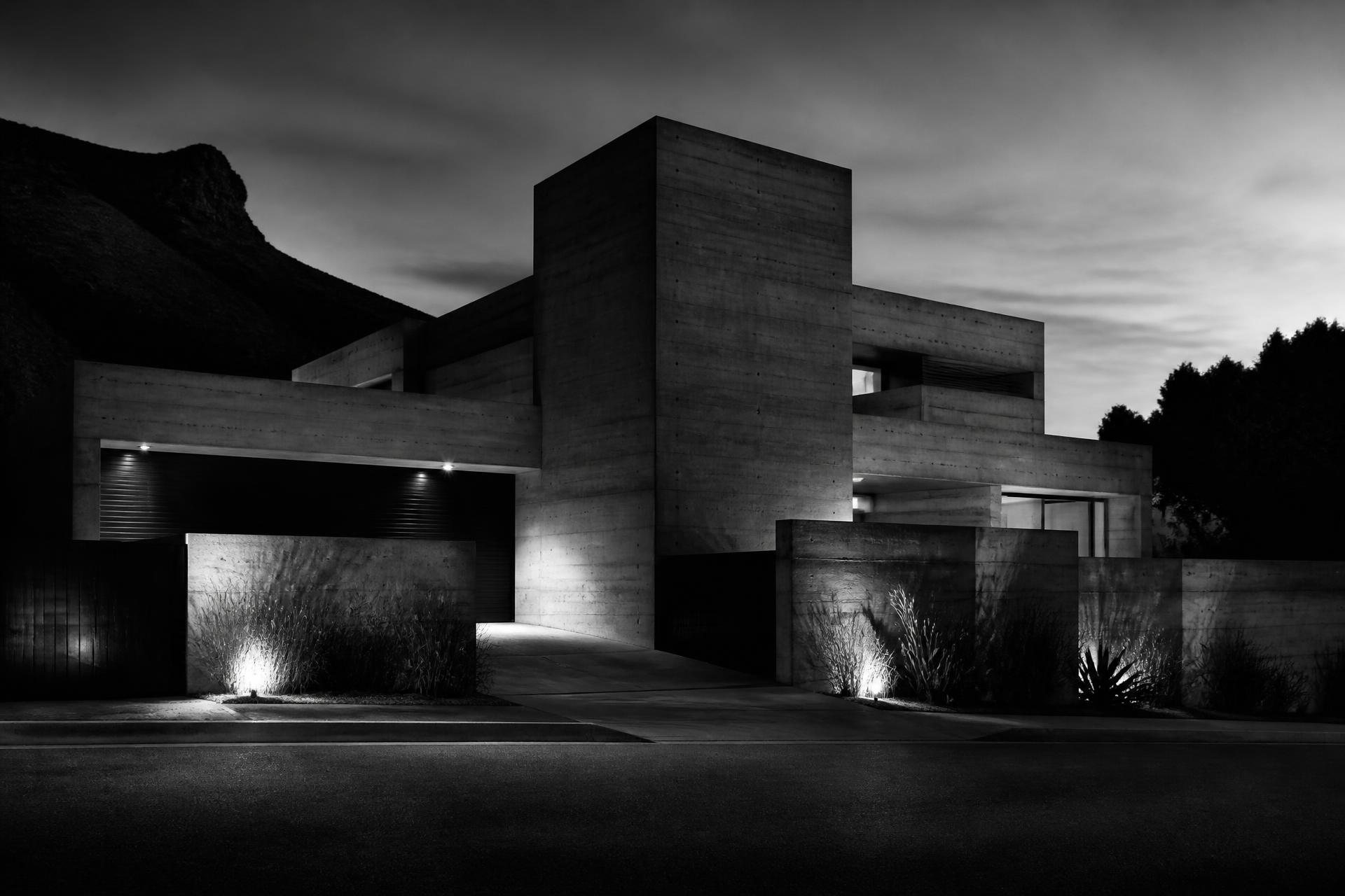 Monochrome South African house exterior at dusk